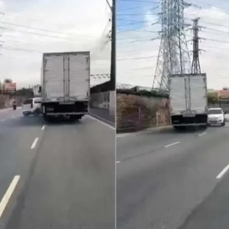 CAMINHÃO ARRASTA CARRO EM BRIGA DE TRÂNSITO