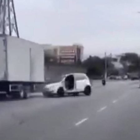 CAMINHÃO ARRASTA CARRO APÓS SUPOSTA BRIGA DE TRÂNSITO