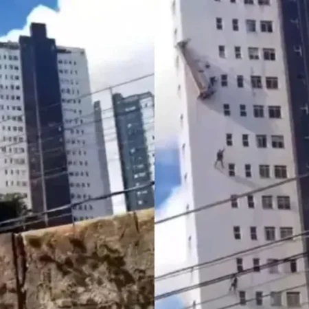 PINTORES FICAM PENDURADOS DO LADO DE FORA DE PRÉDIO